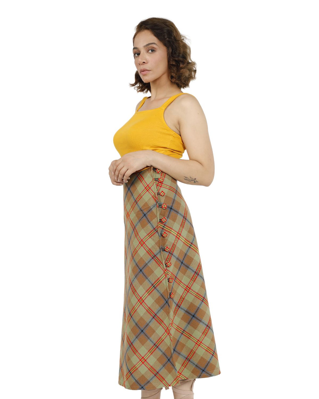 Side view of a beige plaid midi skirt